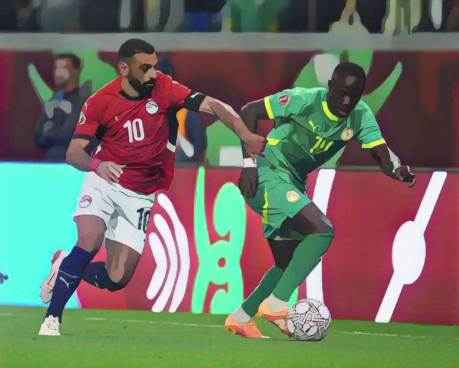 Mohamed Salah battles with his former Liverpool teammate Sadio Mané